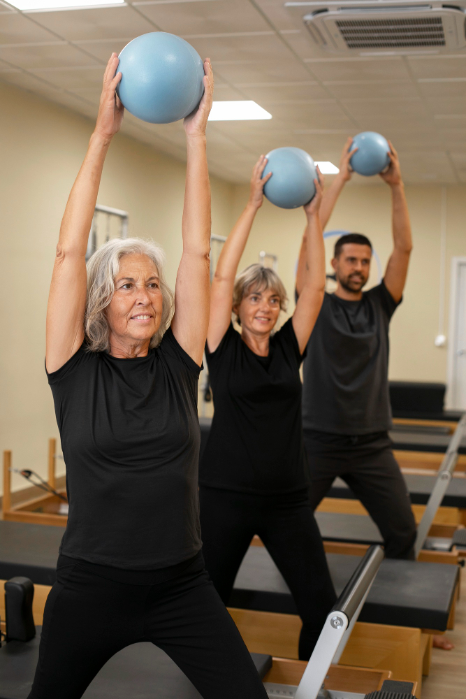 Personal trainer coaching a senior client through a training session